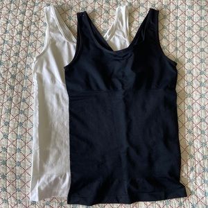 Pair of Yummie shaping tanks, size M/L, black and white.